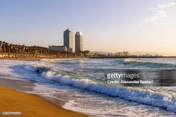 barceloneta beach in the morning, barcelona, spain - barcelona day stock pictures, royalty-free photos & images