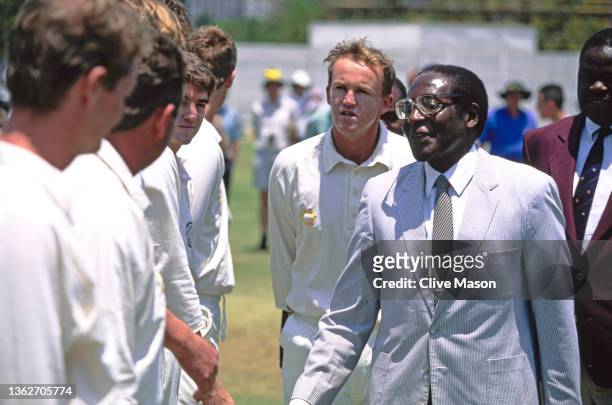 Zimbabwe Prime Minister Robert Mugabe is introduced to the players by Zimbabwe captain Andy Flower during the Test Match between Zimbabwe and South...