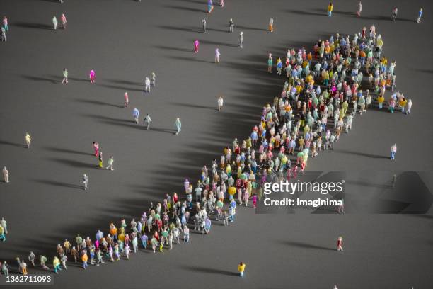 large group of people forming a growing arrow - organisation stock pictures, royalty-free photos & images
