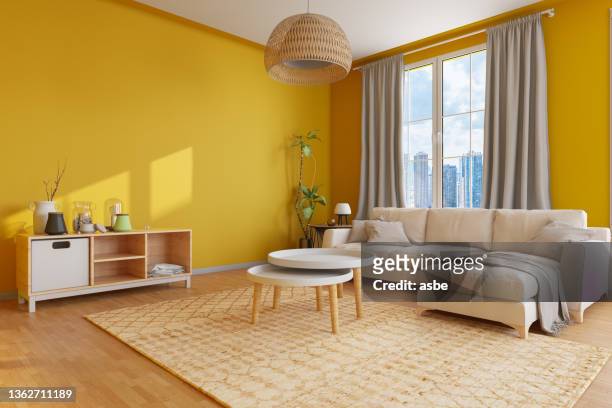 gemütliches wohnzimmer mit gelben wänden - yellow hat stock-fotos und bilder