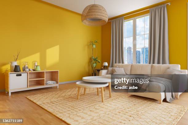 cozy living room with yellow walls - colorful home interior stock pictures, royalty-free photos & images