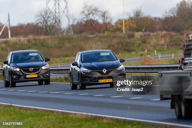 dutch black 2020 renault clio driving in wierden - brand name stock pictures, royalty-free photos & images