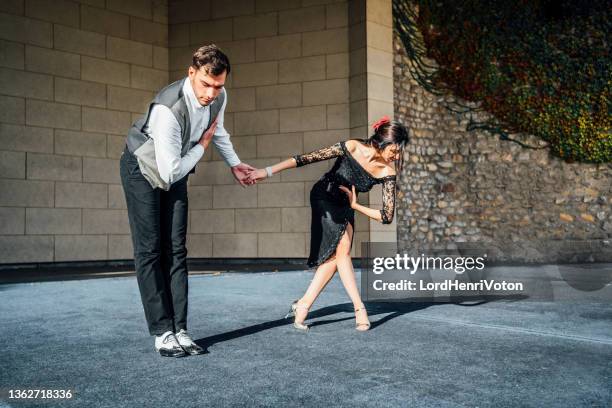 man and woman dancer taking bow on stage - bowing stock pictures, royalty-free photos & images
