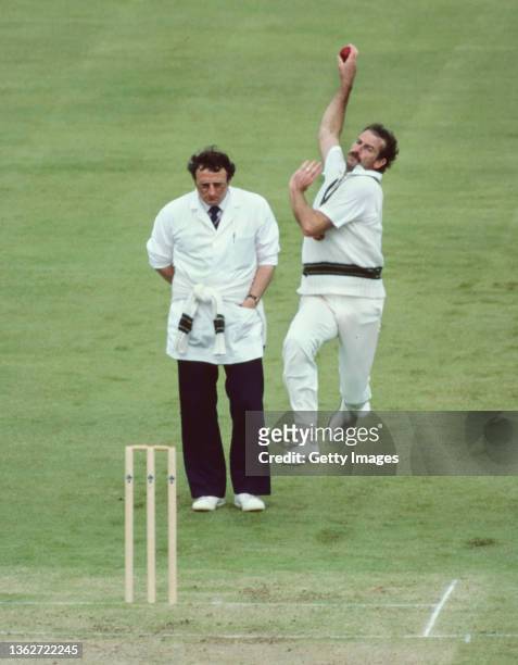 Australia fast bowler Dennis Lillee in bowling action as umpire Mervyn Kitchen looks on during the 1983 Cricket World Cup Match against Zimbabwe at...