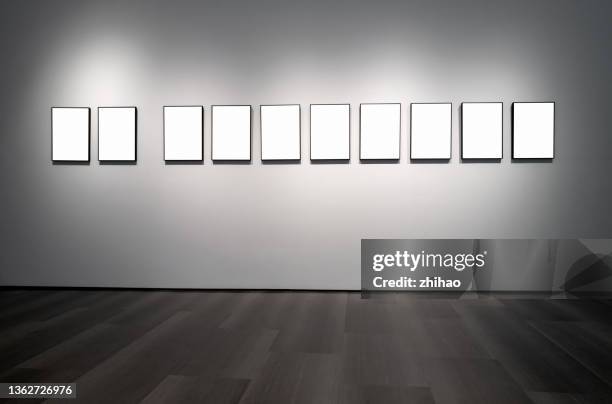 a row of picture frames on the interior wall - empty art gallery stock pictures, royalty-free photos & images