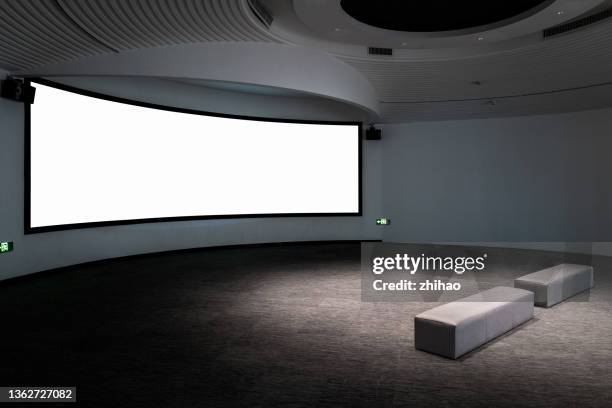 projection screen and seat on the wall - movies gallery stock pictures, royalty-free photos & images