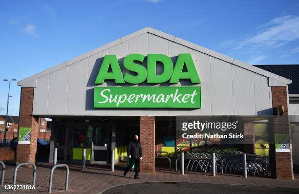 Man shops at Asda supermarket on January 04, 2022 in Cheadle, England .