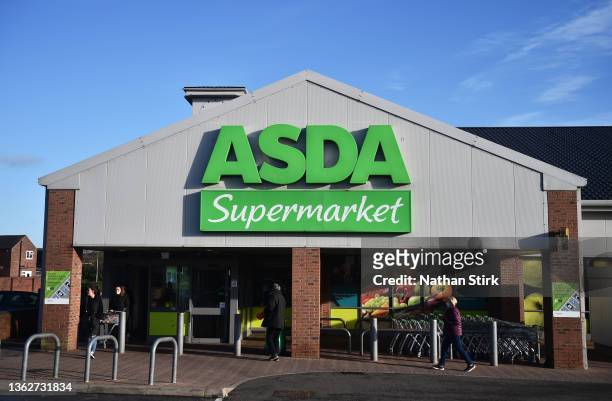 People shop at Asda supermarket on January 04, 2022 in Cheadle, England.