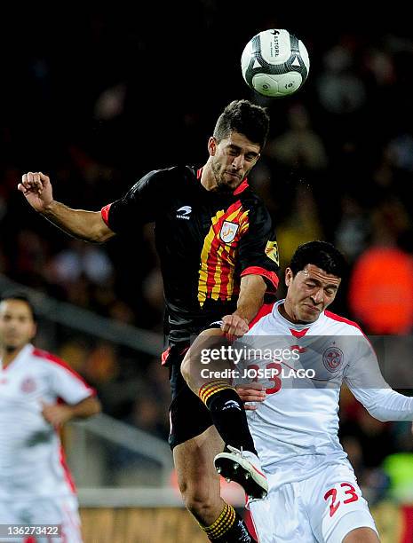 Catalonia's Didac Vila vies with Tunisia's Amine Chermiti during a friendly football match between Catalonia National Team and Tunisia National Team...