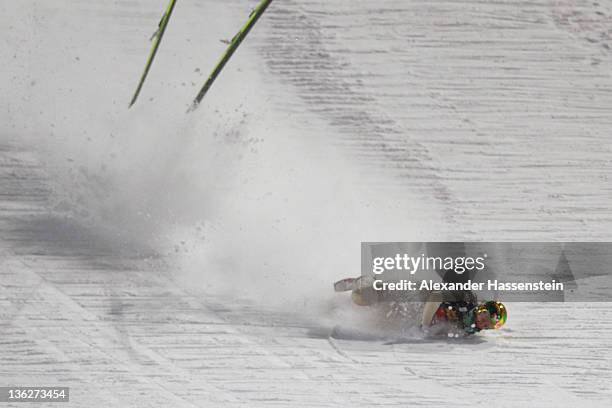 Tom Hilde of Norway crashes during the final round for the FIS Ski Jumping World Cup event of the 60th Four Hills ski jumping tournament at Erdinger...