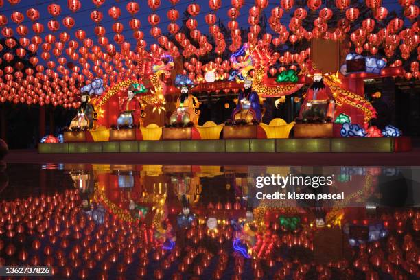 chinese new year and lantern festival in a chinese temple illuminated at night . - chinese lantern stock-fotos und bilder