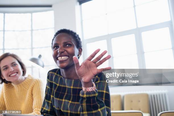 happy businesswoman talking in meeting - office excitement stock pictures, royalty-free photos & images