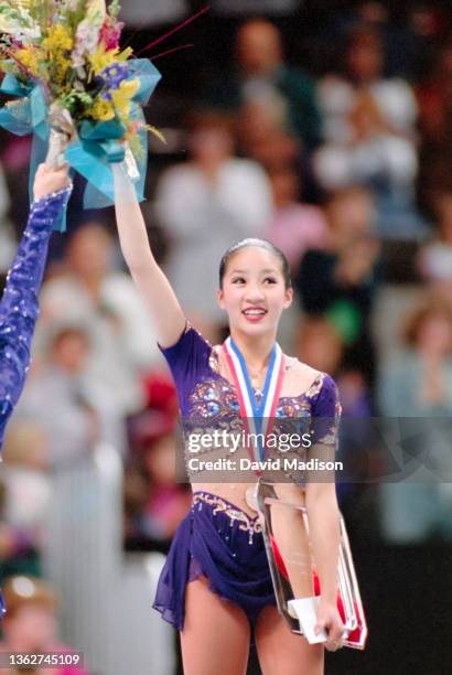 Michelle Kwan of the USA takes part in the awards ceremony after winning the Ladies' Singles Competition of the 1996 United States Figure Skating...