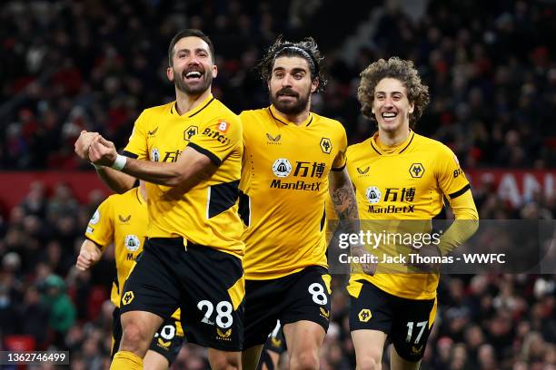 Joao Moutinho of Wolverhampton Wanderers celebrates after scoring his team's first goal during the Premier League match between Manchester United and...