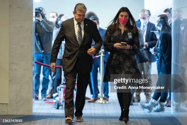 Sen. Joe Manchin walks back to his office after speaking to reporters on Capitol Hill on January 04, 2022 in Washington, DC. Manchin took questions...