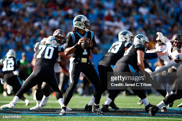Cam Newton of the Carolina Panthers looks to pass during the first half of the game against the Tampa Bay Buccaneers at Bank of America Stadium on...