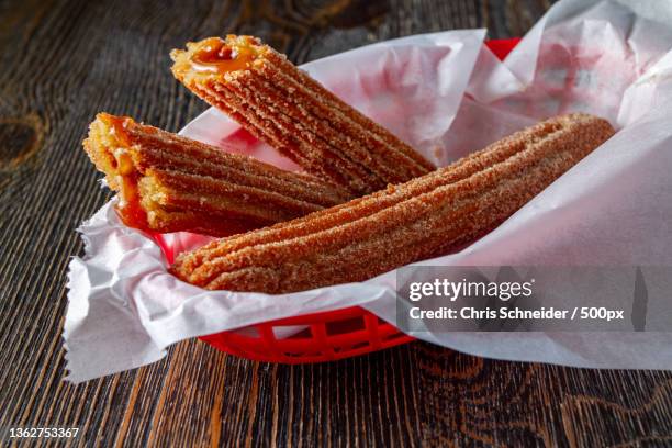 mexican food,high angle view of food in basket on table,massachusetts,united states,usa - churros stock pictures, royalty-free photos & images