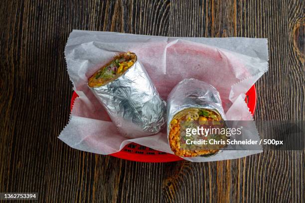 mexican food,high angle view of food on table,massachusetts,united states,usa - burrito stockfoto's en -beelden