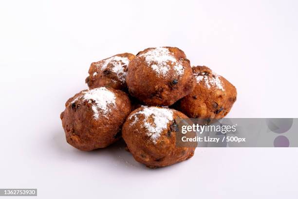 a pile of dutch traditional oliebollen dough balls,white background,amsterdam,netherlands - oliebol bildbanksfoton och bilder