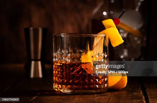 sazerac,classic alcoholic cocktail with cognac,bourbon,absinthe,close-up of drink in glass on table - old fashioned whiskey stock pictures, royalty-free photos & images