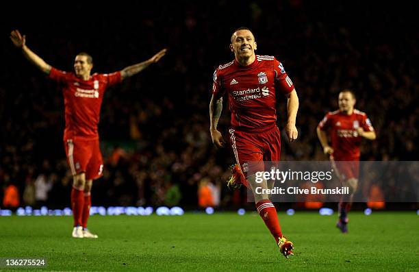 Craig Bellamy of Liverpool celebrates scoring his team's second goal during the Barclays Premier League match between Liverpool and Newcastle United...