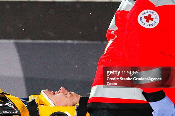 Tom Hilde of Norway receives assistance after crashing during the FIS Ski Jumping World Cup Vierschanzentournee on December 30, 2011 in Oberstdorf,...