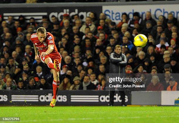 Craig Bellamy of Liverpool scores the second during the Barclays Premier League match between Liverpool and Newcastle United at Anfield on December...