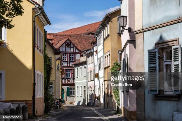 historic buildings in the old town of bamberg (bavaria, germany) - bavarian man in front of house stock-fotos und bilder