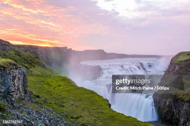 gulfoss iceland,scenic view of waterfall against sky during sunset,gullfoss falls,iceland - gullfoss falls stock-fotos und bilder