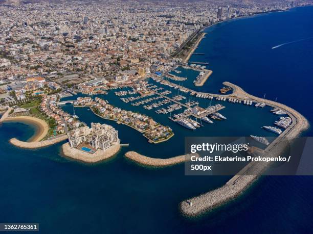 aerial drone shot of limassol marina in cyprus,blue mediterranean sea - limassol stock pictures, royalty-free photos & images