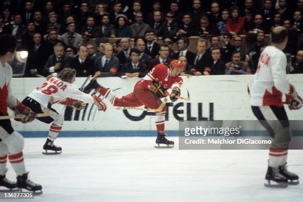Bobby Clarke of Canada tries to block the shot of Alexander Yakushev of the Soviet Union during the 1972 Summit Series at the Luzhniki Ice Palace in...