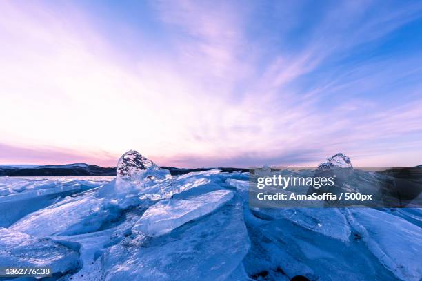 scenic view of frozen sea against sky during sunset - landslag imagens e fotografias de stock