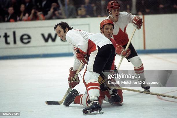 Ron Ellis and Paul Henderson of Canada defend against an unidentified player from the Soviet Union during the 1972 Summit Series at the Luzhniki Ice...