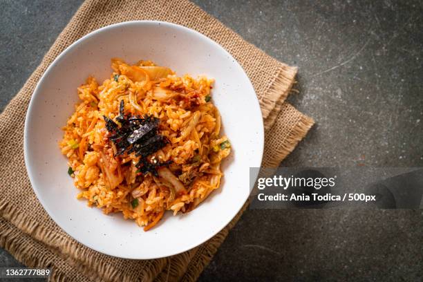 kimchi fried rice with seaweed and white sesame - kimchi stock pictures, royalty-free photos & images