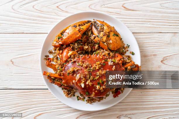 stir fried crab with spicy salt pepper - chilli crab stock pictures, royalty-free photos & images