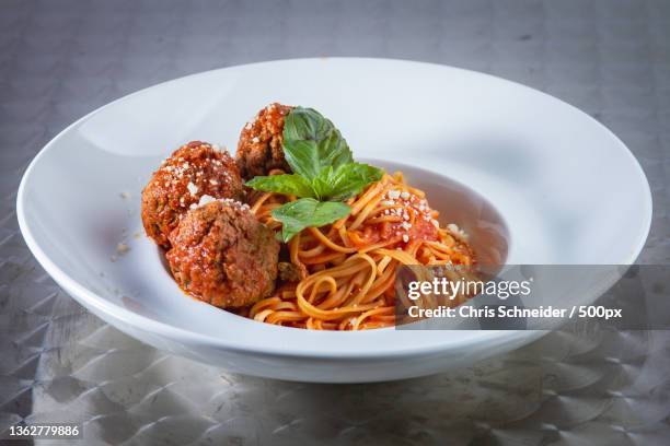 italian food,high angle view of noodles in bowl on table - gehaktbal stockfoto's en -beelden