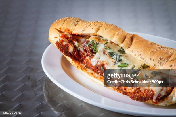 italian food,close-up of food in plate on table - sub sandwich stock pictures, royalty-free photos & images