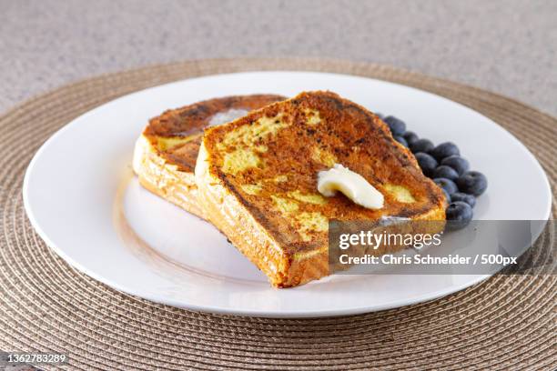 american food,high angle view of dessert in plate on table,massachusetts,united states,usa - pain perdu stockfoto's en -beelden