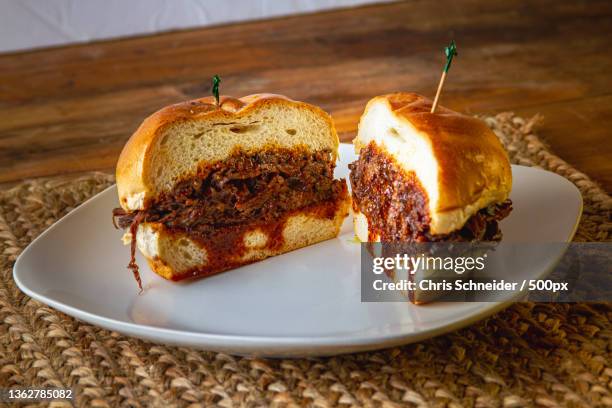 american food,close-up of cake in plate on table,rhode island,united states,usa - bbq sandwich stockfoto's en -beelden