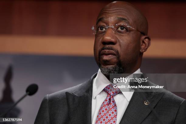 Sen. Raphael Warnock speaks at a news conference following a virtual weekly Senate Democratic Policy meeting at the U.S. Capitol Building on January...