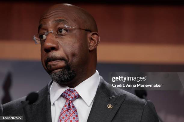 Sen. Raphael Warnock speaks at a news conference following a virtual weekly Senate Democratic Policy meeting at the U.S. Capitol Building on January...