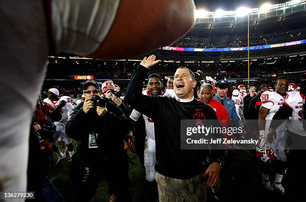 Rutgers Scarlet Knights head coach Greg Schiano celebrates a win over the Iowa State Cyclones in the New Era Pinstripe Bowl at Yankee Stadium on...