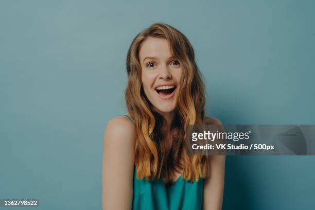 woman showing on camera positive facial expression and toothy smile - funny facial hair stock pictures, royalty-free photos & images