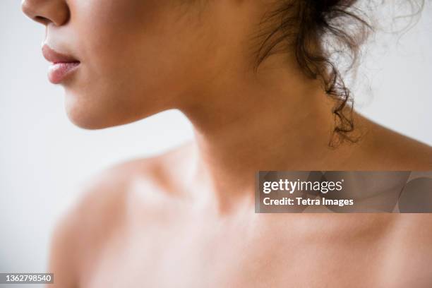 close up of mixed race woman with bare shoulders - beautiful bare women fotografías e imágenes de stock