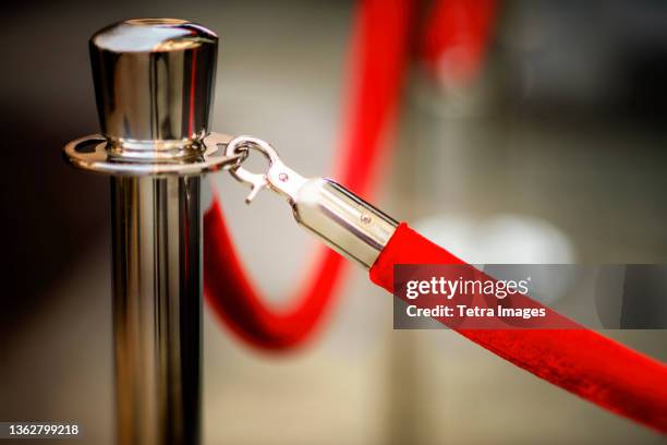 close-up of red rope and stanchion - roped off stockfoto's en -beelden