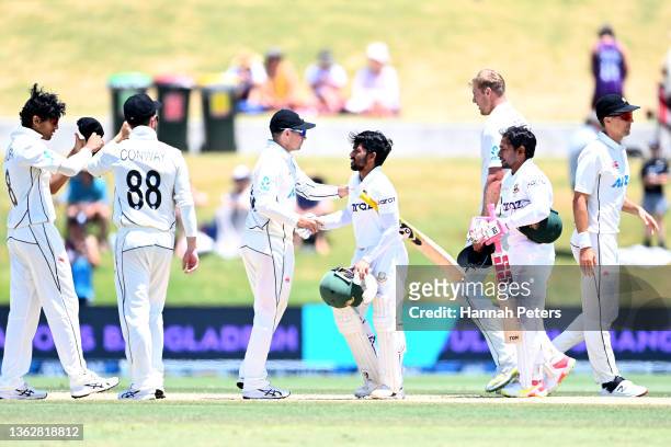 Mominul Haque of Bangladesh shakes hands with Tom Latham of the Black Caps after winning the test match on day five of the First Test Match in the...
