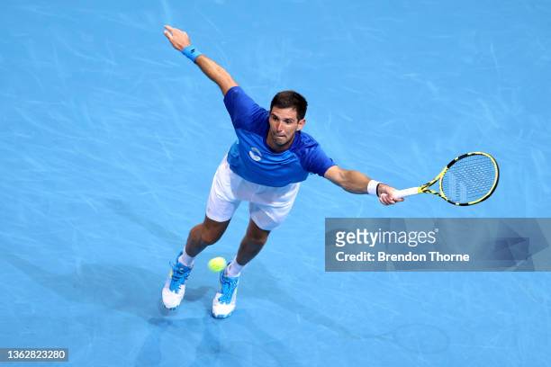 Federico Delbonis of Argentina plays a forehand in his group D match against Kamil Majchrzak of Poland during the day five 2022 ATP Cup tie between...