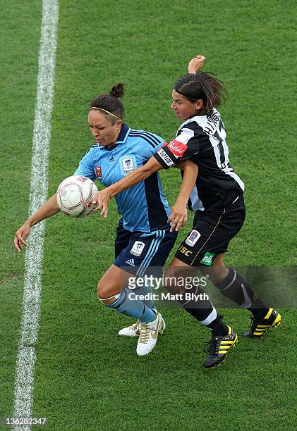 Kyah Simon of Sydney FC competes with Ariane Hingst of the Jets during the round 10 W-League match between Sydney FC and the Newcastle Jets at...