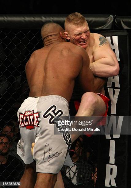 Alistair Overeem and Brock Lesnar struggle against the Octagon fence during the UFC 141 event at the MGM Grand Garden Arena on December 30, 2011 in...