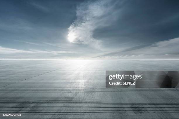 empty parking lot - dramatic sky background stock pictures, royalty-free photos & images